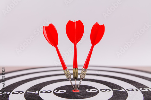red dart darts in the center of the target hit the target won