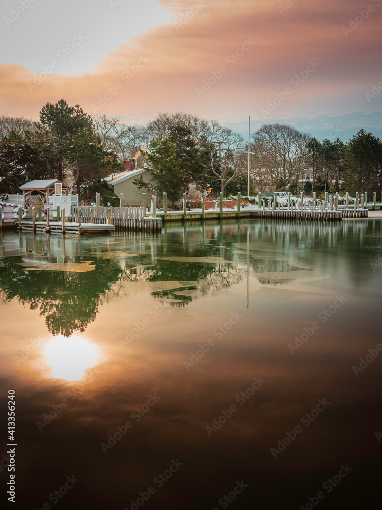 Dramatic sunrise seascape in the cloudy morning at the marina Dramatic sunrise seascape in the cloudy morning at the marina
