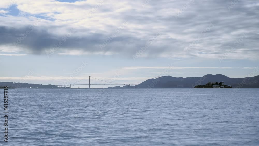 Time lapse: sailing boat on the sea, golden gate bridge and Alcatraz island Time lapse: sailing boat on the sea, golden gate bridge and Alcatraz island