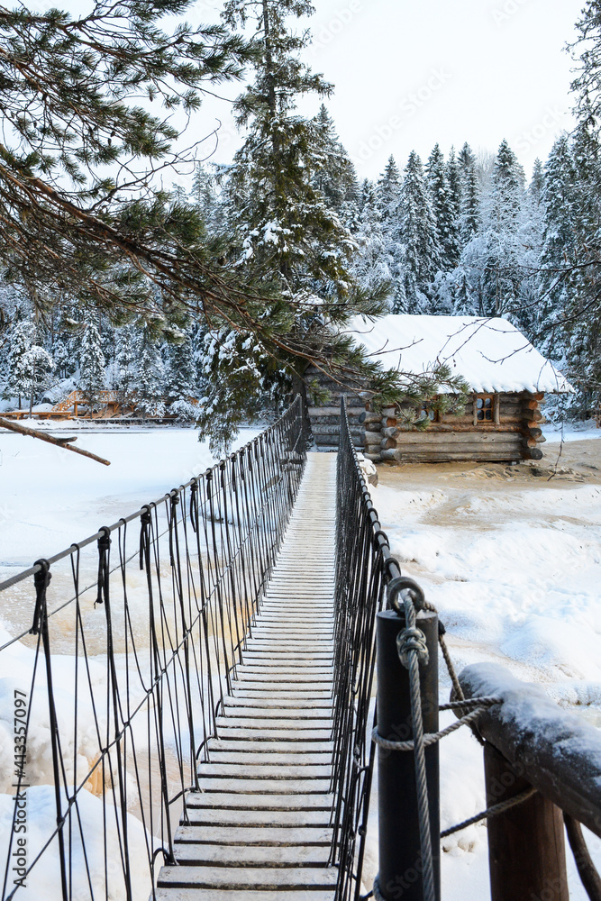 RUSKEALA, RUSSIA- JANUARY 15, 2021: Rope bridge through Ruskeala Waterfalls in winter