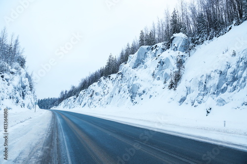 winter road between huge rocks 