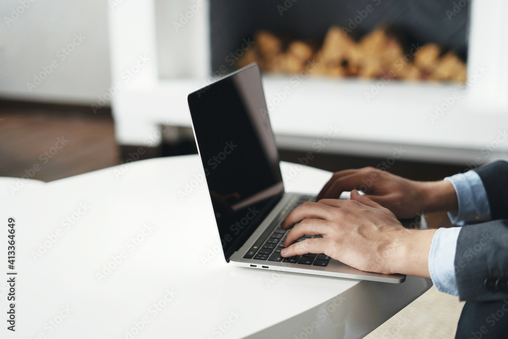 men's hand in front of the computer laptop, typing a message. it is used on a modern tablet. men's hand in front of the computer laptop, typing a message. it is used on a modern tablet.