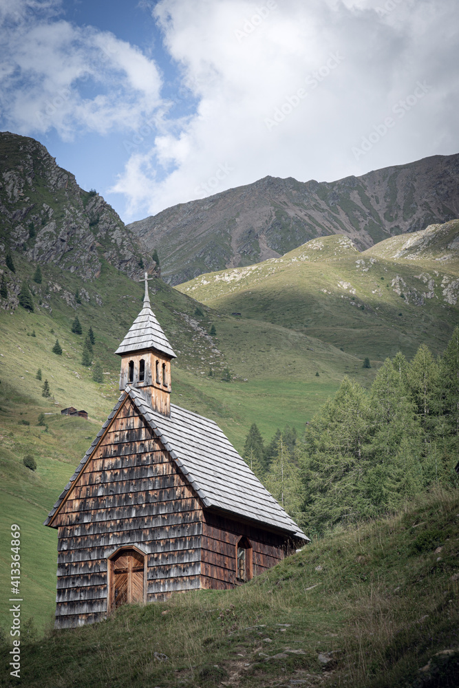 small chapel in the mountains on a cloudy day small chapel in the mountains on a cloudy day