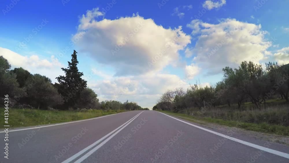 POV car travel along olive orchards, mediterranean landscape, blue sky clouds horizon, asphalt road point of view vehicle drive POV car travel along olive orchards, mediterranean landscape, blue sky clouds horizon, asphalt road point of view vehicle drive