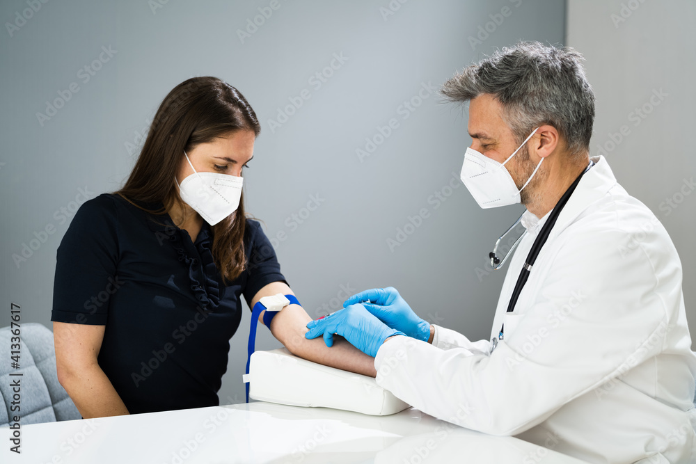 Fototapeta premium Blood Draw By Doctor In Laboratory