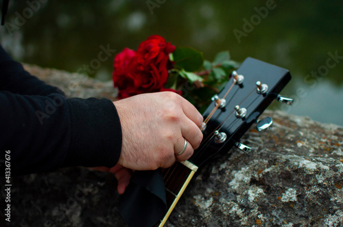 Man cleaning guitar on the Roman Bridge in Sarajevo