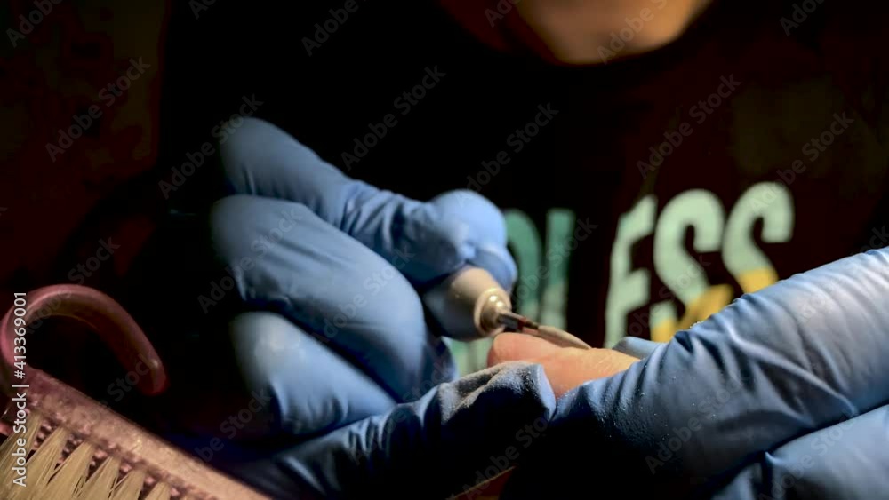 Manicure master, nail care specialist makes a manicure for a man Manicure master, nail care specialist makes a manicure for a man