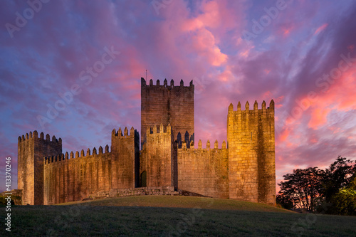 Guimaraes castle at sunset, in Portugal photo