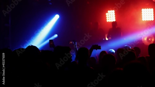 Wallpaper Mural Fans are recording videos on smartphones. Musical concept. Live Stream. Stories. The crowd watches a concert, sings, jumps. Strobing stage lights. Happy people at the concert. Torontodigital.ca