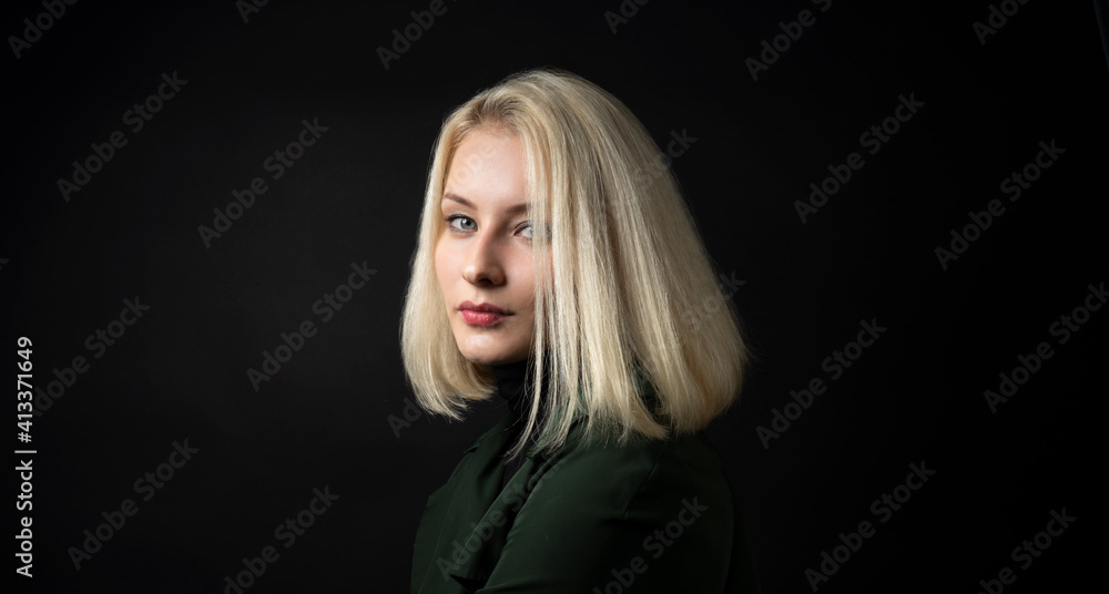 close up of pale blonde woman isolated on dark background close up of pale blonde woman isolated on dark background