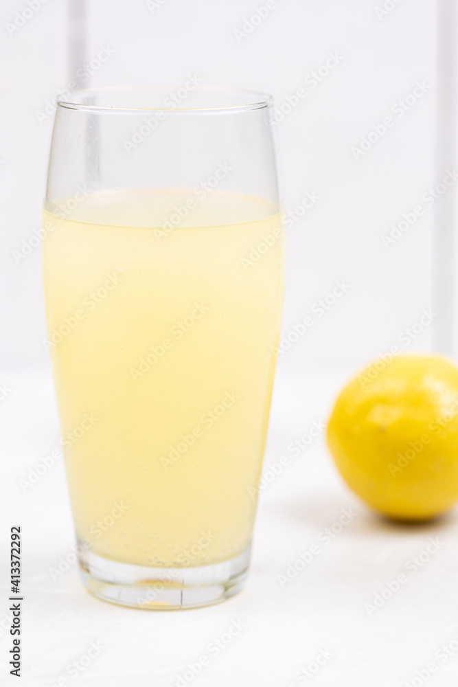 Homemade Lemonade in the glass with lemons on the table Homemade Lemonade in the glass with lemons on the table
