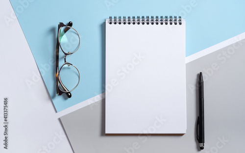 Real photo, stationery branding mockup notepad template to place your design, isolated on light gray blue background. Modern Stylish male business, graphic summer office supplies