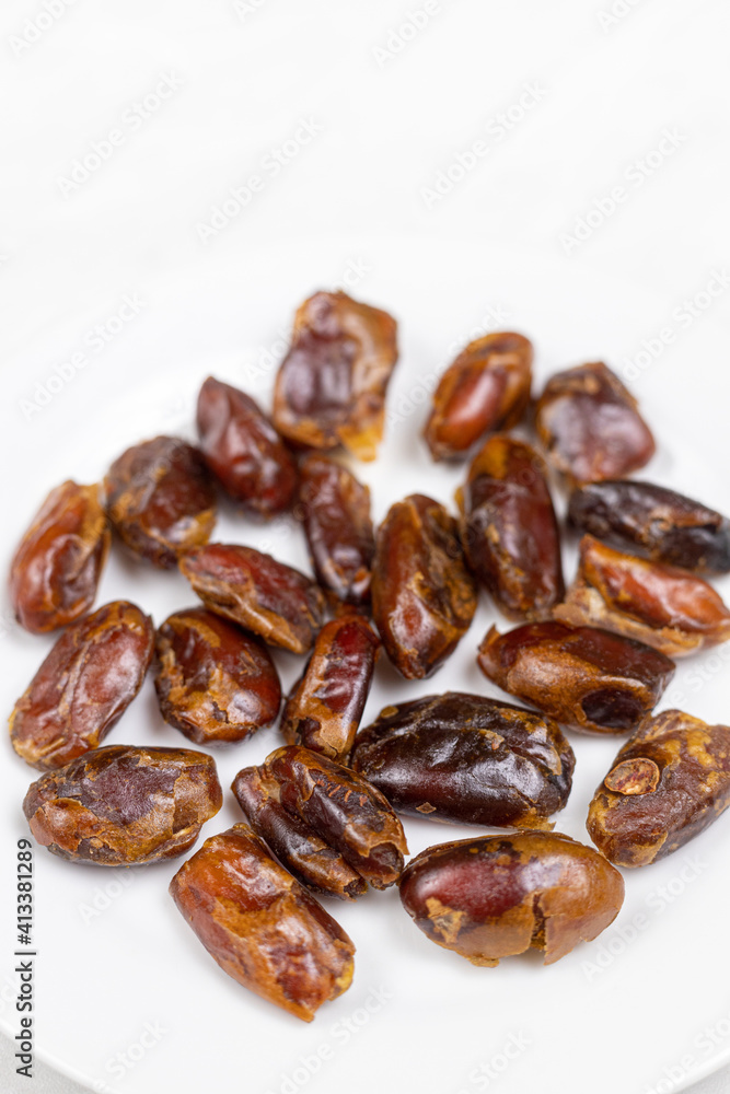 Healthy Dates on the white plate with copy space