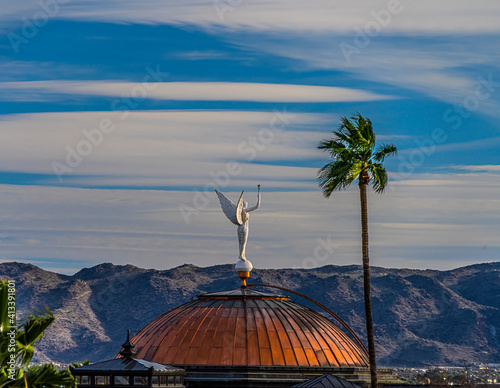 'Wounded Goddess' statue atop the Arizona State Capitol Building in Phoenix Arizona. Other names: Statue of Justice; Winged Victory; Goddess of Victory;   photo
