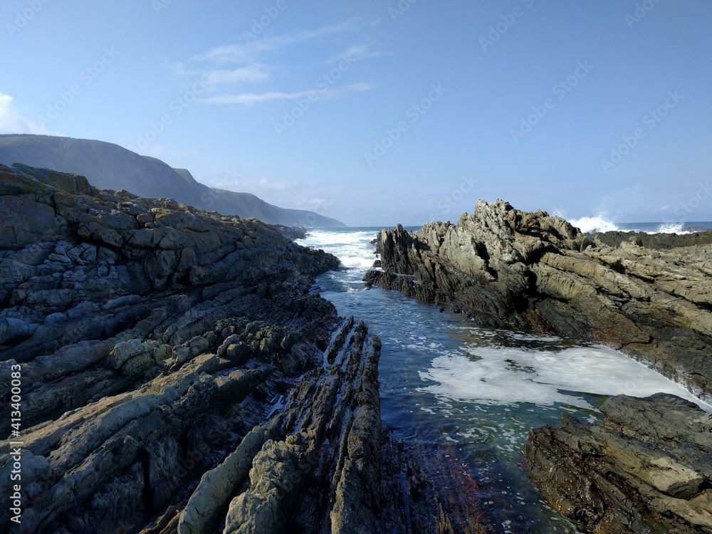 Water beteen the rocks on the beach Water beteen the rocks on the beach