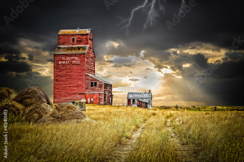 old abandoned elevator under a dark stormy sky with lightening