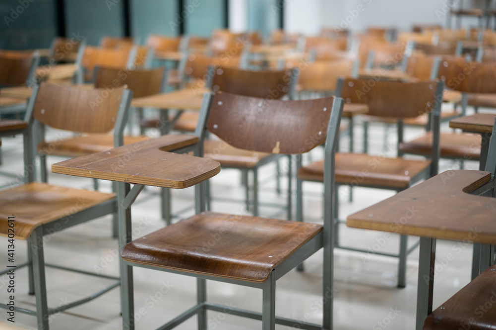 Wooden chairs are well arranged in the classroom. Empty classroom with vintage tone wooden chairs. Back to school concept.. Wooden chairs are well arranged in the classroom. Empty classroom with vintage tone wooden chairs. Back to school concept..
