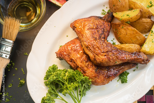 Baked chicken with potatoes and salad 
