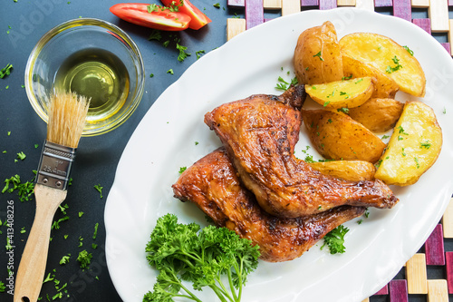 Baked chicken with potatoes and salad 