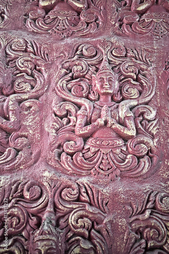 thai style sculpture on the wall
