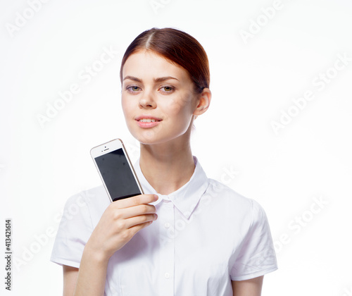 pretty woman in white shirt secretary with phone in hands technology communication