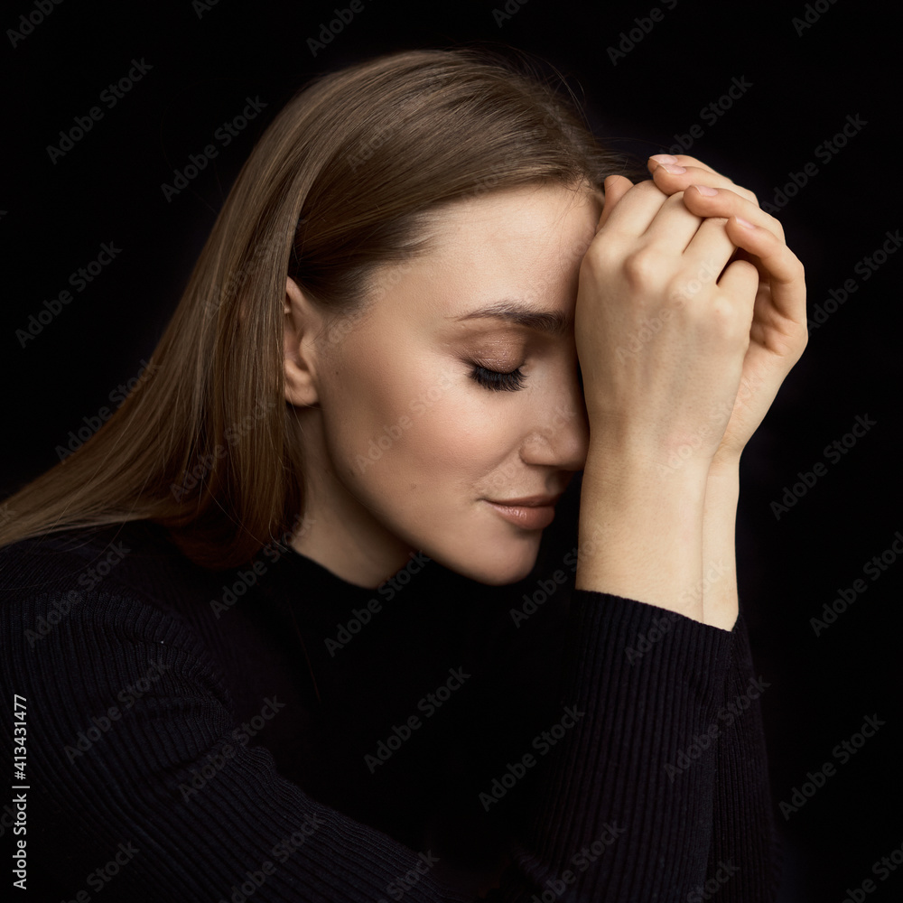 Sexy Female Model Low-key Portrait. Portrait of beautiful caucasian woman in black dress on black background. High quality photo Sexy Female Model Low-key Portrait. Portrait of beautiful caucasian woman in black dress on black background. High quality photo