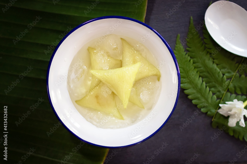 Dessert made with glutinous rice wrapped in banana leaves, triangle shape, boiled, eaten with syrup and ice. Thai Dessert; called Kao Tom Nam Woon. Dessert made with glutinous rice wrapped in banana leaves, triangle shape, boiled, eaten with syrup and ice. Thai Dessert; called Kao Tom Nam Woon.