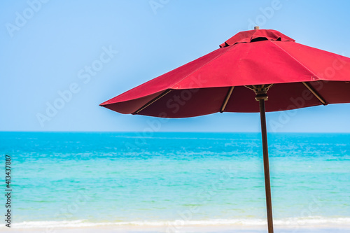 Empty deck chair lounge with umbrella around on beach sea ocean