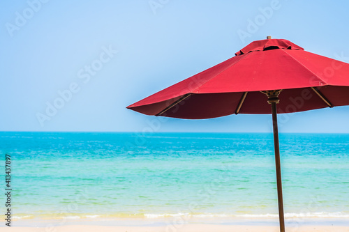 Empty deck chair lounge with umbrella around on beach sea ocean