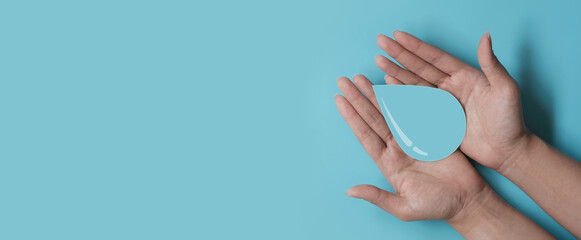 woman hands holding water drop, world water day, CSR, save water resource, world ocean day concept