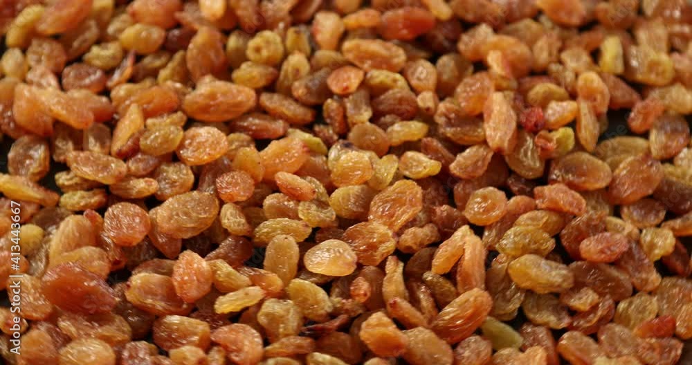 Pile of yellow raisins rotating Pile of yellow raisins rotating