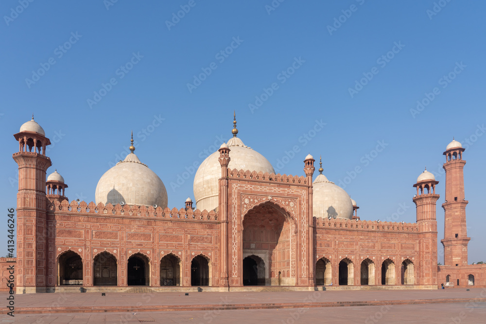 Morning view of beautiful ancient Badshahi mosque with courtyard built by mughal emperor Aurangzeb a landmark of Lahore, Punjab, Pakistan