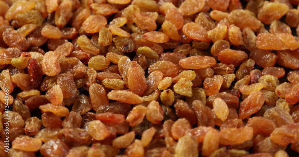 Pile of yellow raisins rotating Pile of yellow raisins rotating