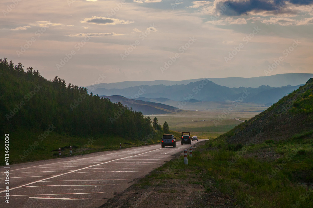 The road across the pass at the end of a summer day The road across the pass at the end of a summer day