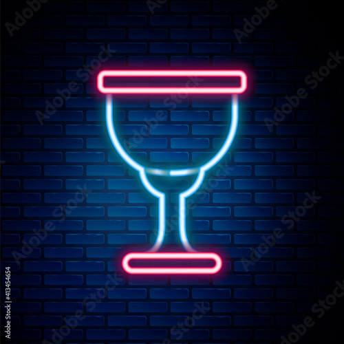 Glowing neon line Holy grail or chalice icon isolated on brick wall background. Christian chalice. Christianity icon. Colorful outline concept. Vector.