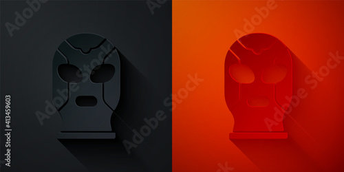 Paper cut Mexican wrestler icon isolated on black and red background. Paper art style. Vector.