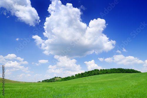 Idyllic landscape, view of green fields and blue sky