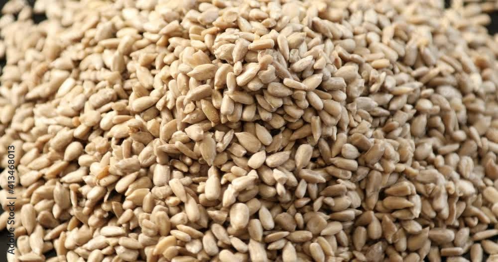 Top view pile of peeled sunflower seeds rotating Top view pile of peeled sunflower seeds rotating