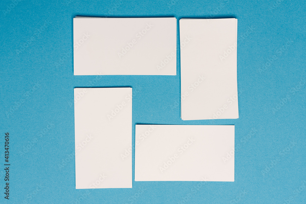 white business cards mockup placed randomly on the office desk white business cards mockup placed randomly on the office desk