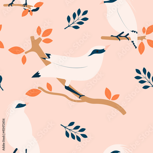 Tropical seamless pattern with Bali myna and plants. photo