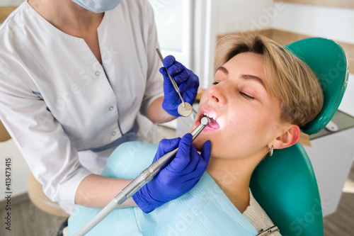 Woman at the dentist consultation. Checking and dental treatment in a clinic