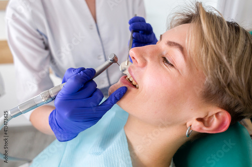 Woman at the dentist consultation. Checking and dental treatment in a clinic