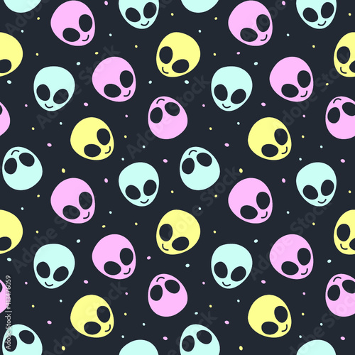 Pastel blue, pink, and yellow alien heads scattered on a dark gray background with stars. Seamless repeating vector illustration background.