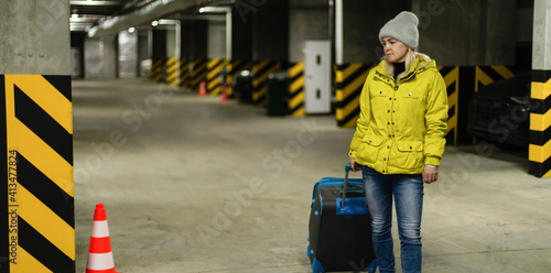 woman walking with bag in the underground parking