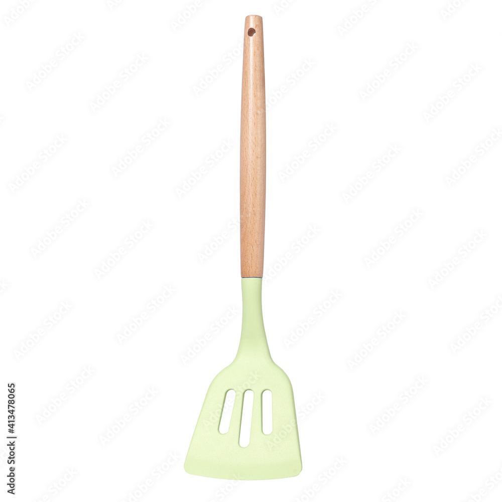 Green silicone kitchen spatula with slots with wooden handle isolated on white background Green silicone kitchen spatula with slots with wooden handle isolated on white background