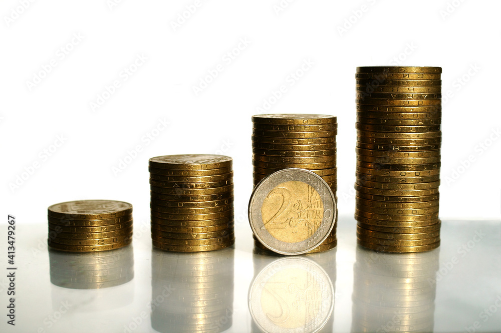 Columns of coins with euro coin