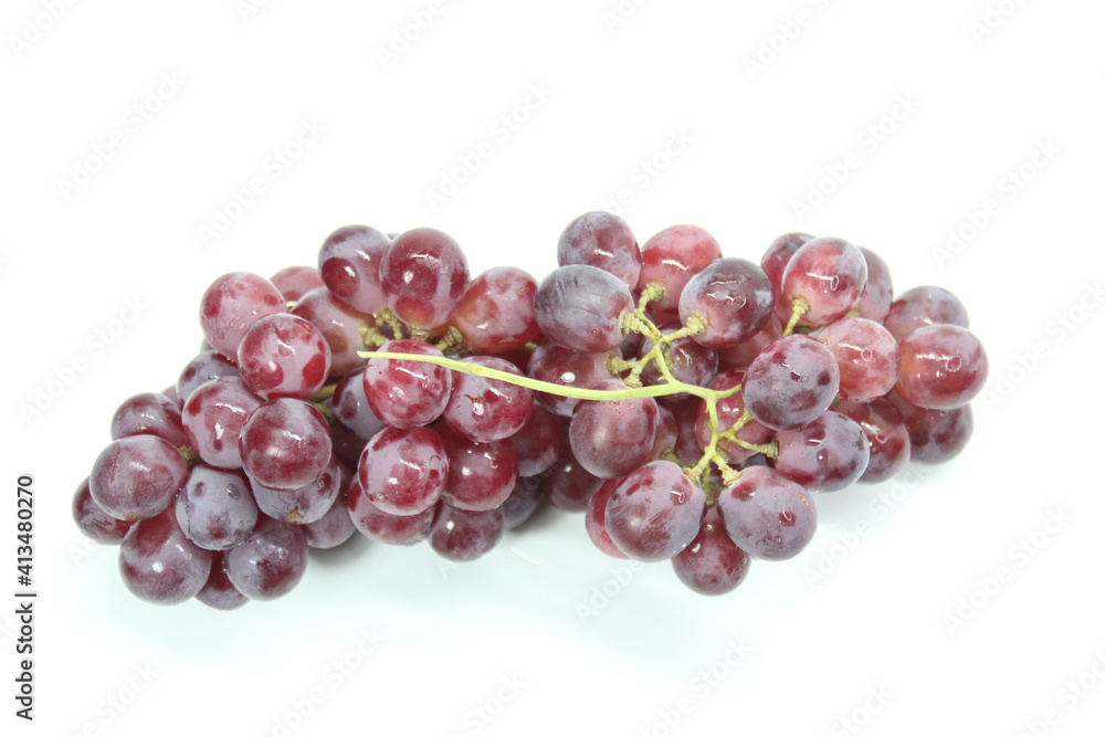 fresh purple grapes with a white background. Selective focus. fresh purple grapes with a white background. Selective focus.