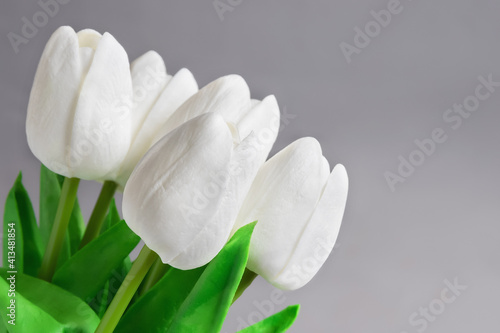 Fototapeta Naklejka Na Ścianę i Meble -  bouquet of white tulips on gray background
