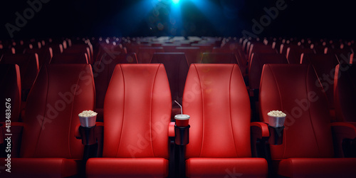 Empty movie theatre with red seat pads photo