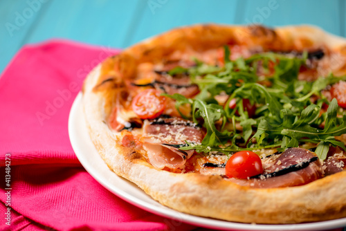 Christmas pizza on the wood board. Holiday celebration pizza. Italian cuisine concept.